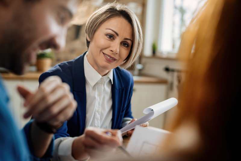 A solicitor holds a meeting with her clients