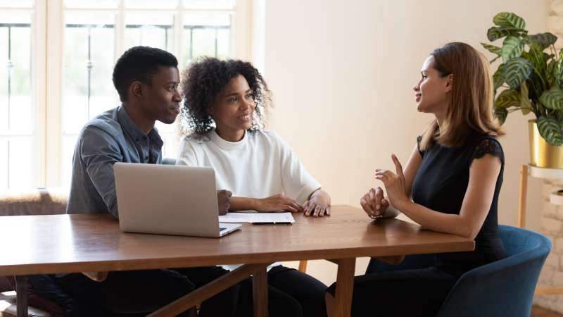 A young couple consult a solicitor about a dispute with their landlord