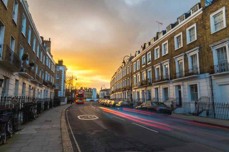 Traditional terraced properties in London, England, pictured at sunset