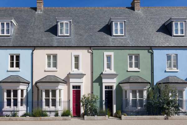 Colourful leasehold terraced houses, pictured on a sunny day